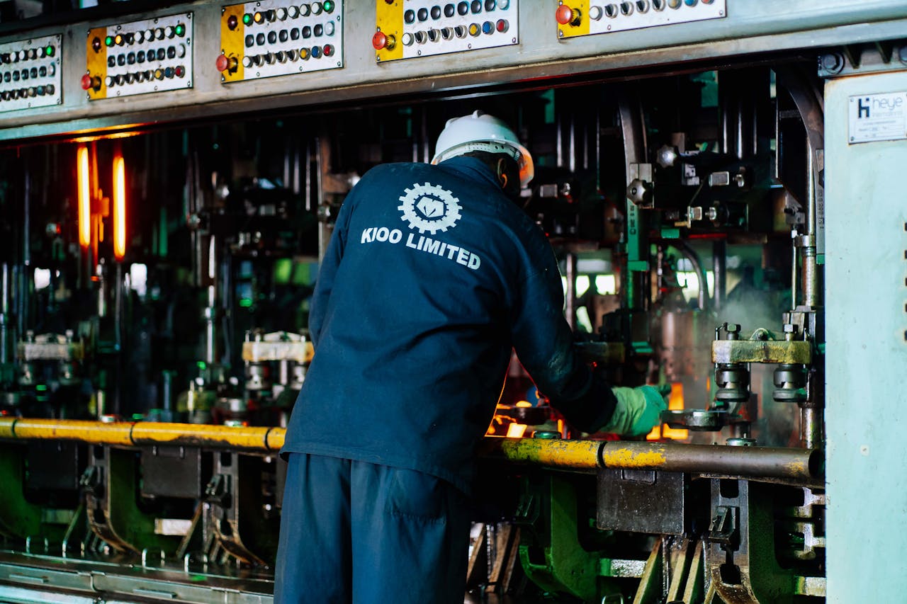 services-01 Worker supervises glass production at Kioo Limited factory in Dar es Salaam, Tanzania.